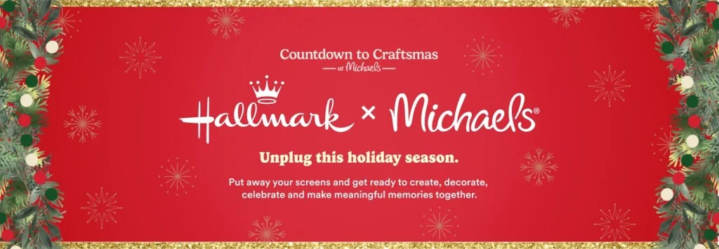 A festive promotional image featuring a red background adorned with snowflakes and greenery. It presents a collaboration between Hallmark and Michaels, encouraging people to unplug during the holiday season and engage in creative activities together.