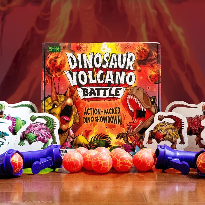A colorful board game box titled 'Dinosaur Volcano Battle' featuring vibrant dinosaur illustrations, surrounded by game pieces including toys and small balls designed for a dino-themed action game.