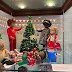 Seven Sasha Dolls Bring Christmas Scenes to a Library Display