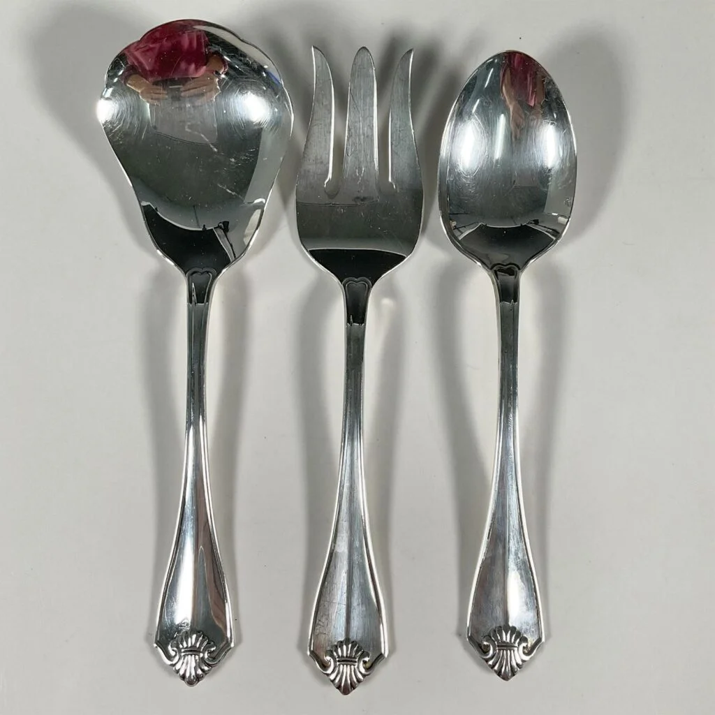 King James silverplate serving spoons and fork.