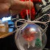 Handmade Holiday Doll Ornaments Feature a Skater and a Sledding Boy